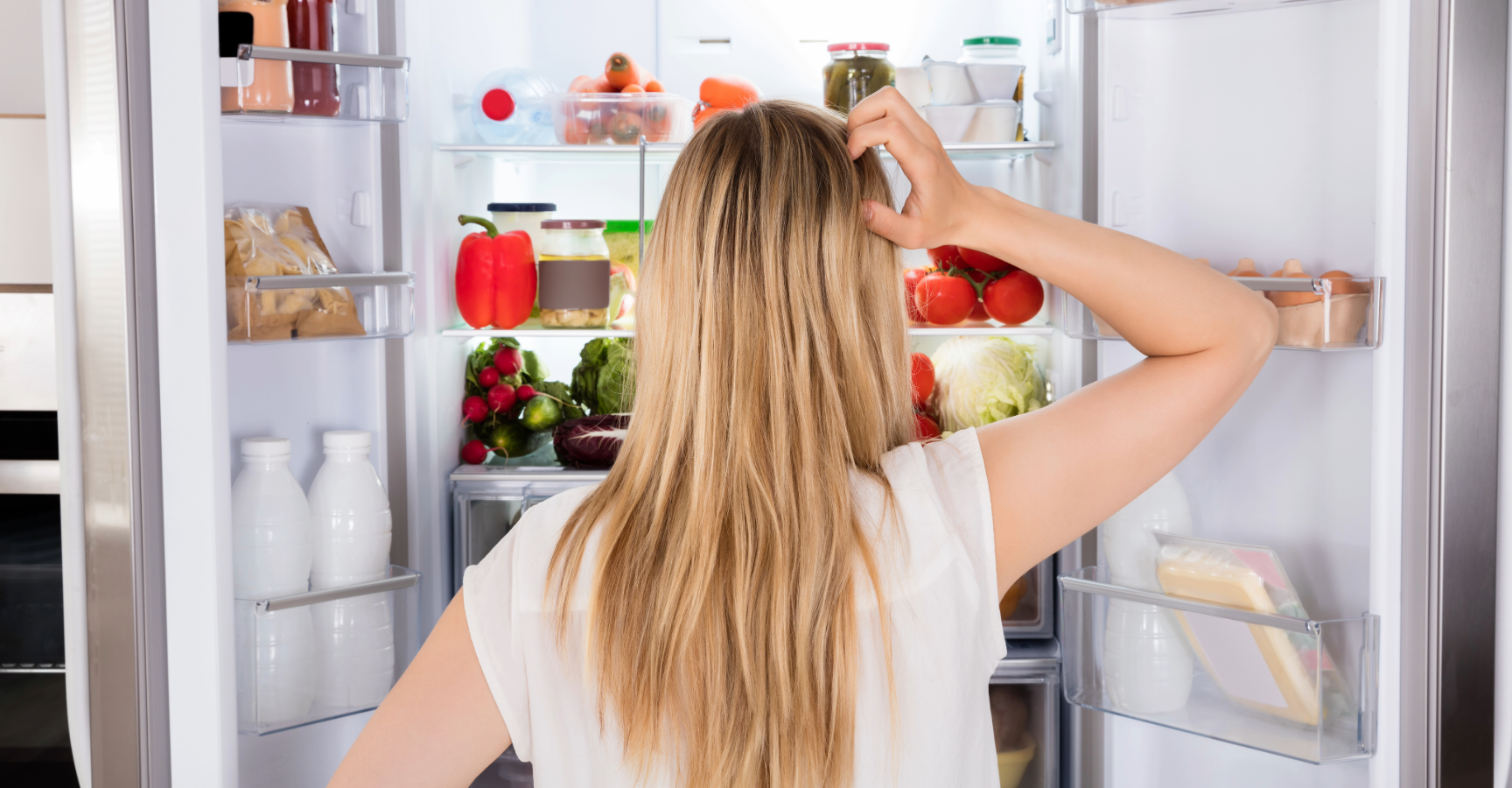 Decision fatigue at dinnertime - Mum staring into fridge