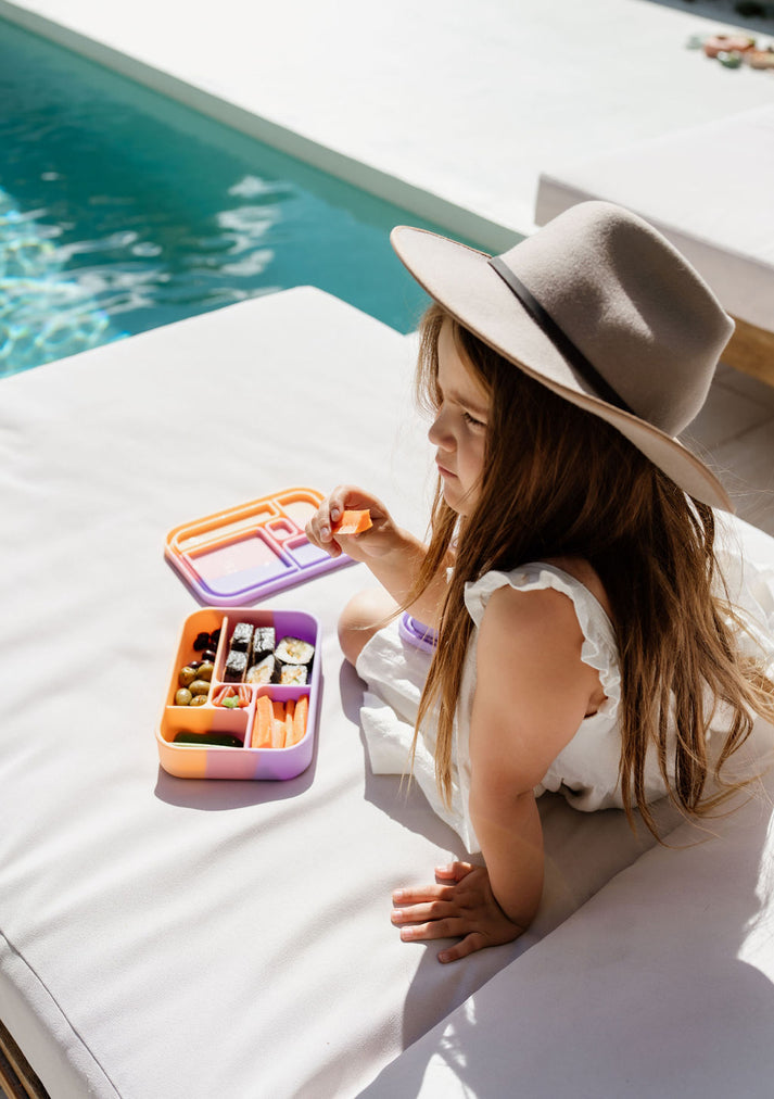 Girl eating from Paddle Pop Bento Lunchbox from The Zero Waste People