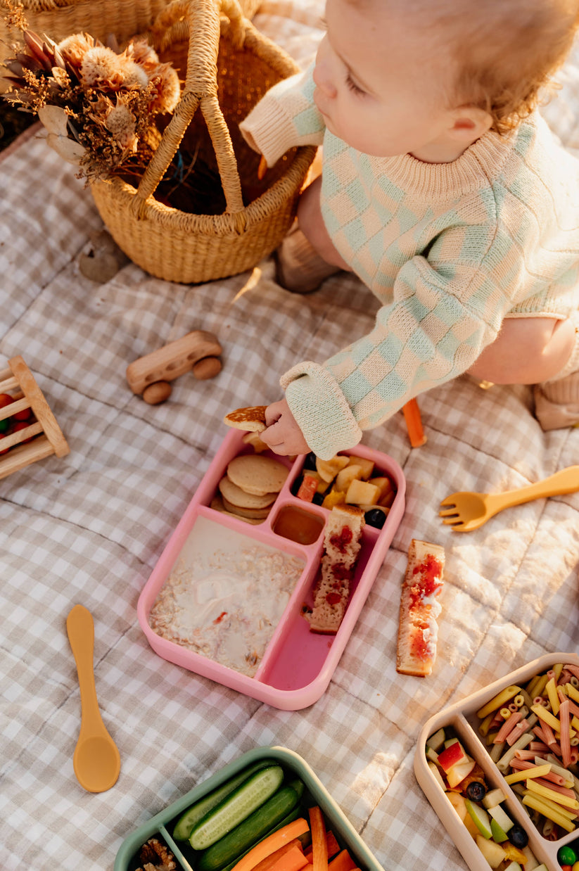 Baby eating from Watermelon Bento Lunchbox from The Zero Waste People