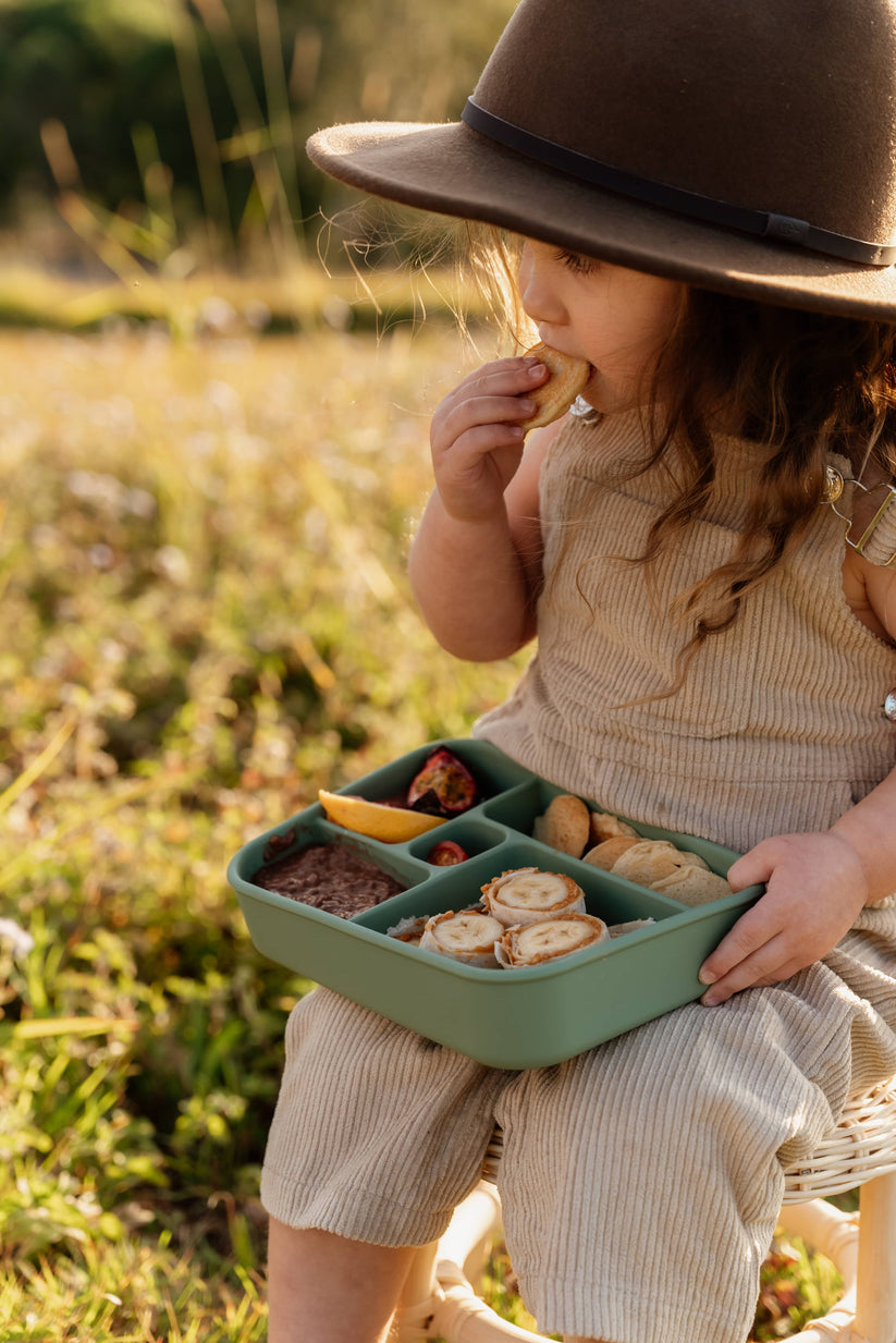 Toddler eating from Sage Bento Lunchbox from The Zero Waste People