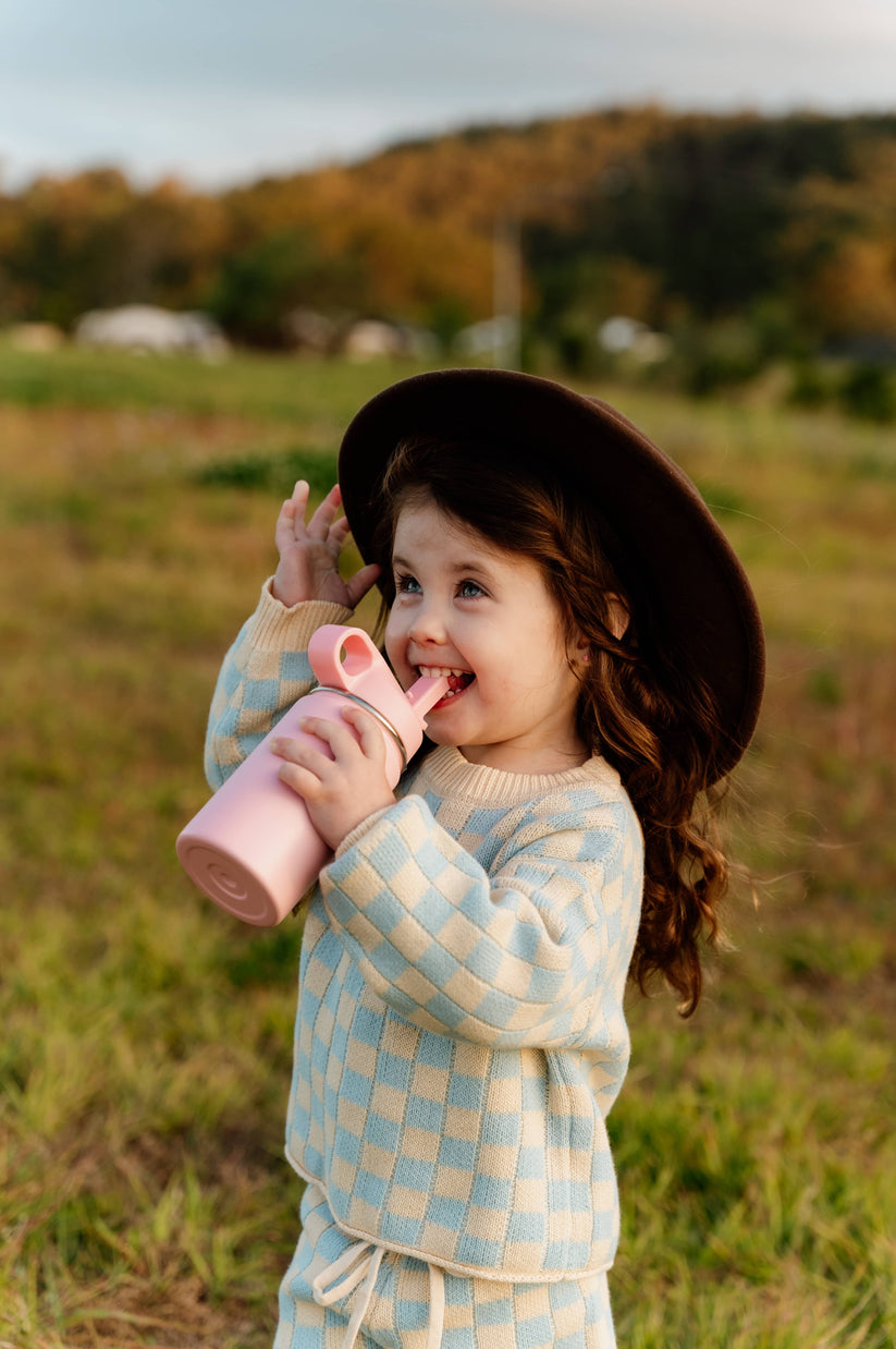 Toddler drinking from a water bottle from The Zero Waste People
