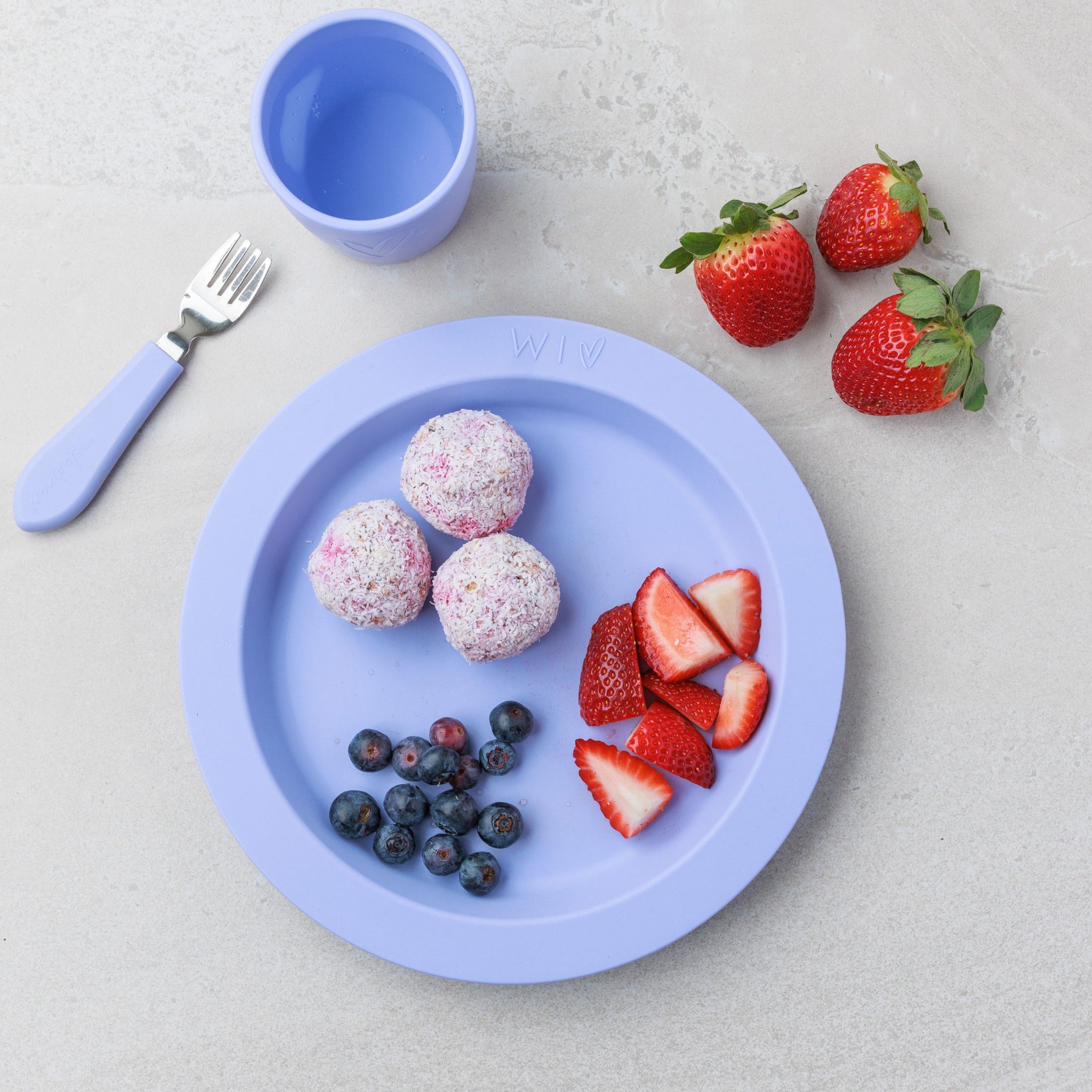 A plate of Raspberry Bircher Bites served with fruit from Audrey and Alfie's Finger Food Range