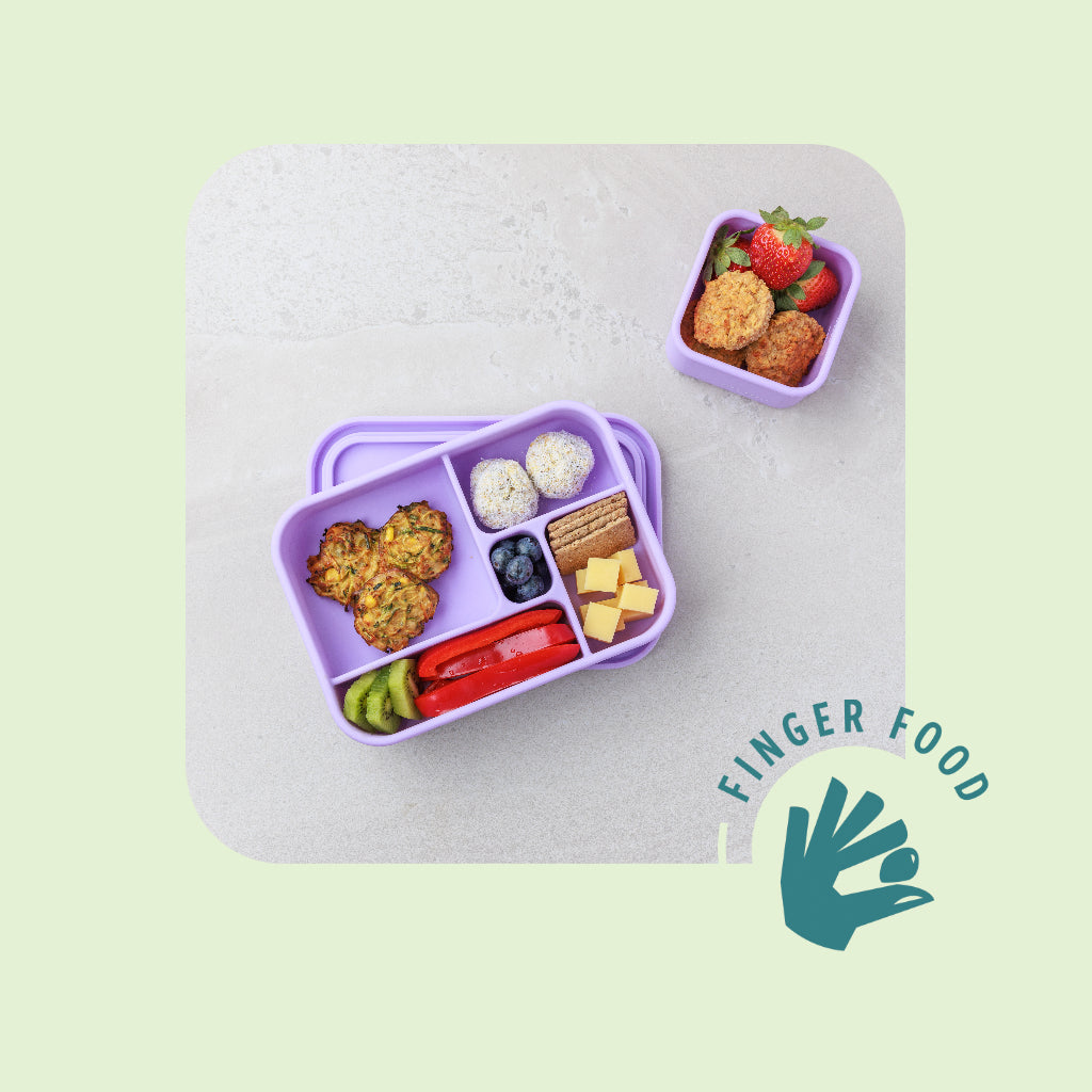 A lunchbox with Audrey & Alfie Finger Food, including Zucchini & Corn Fritters, Raspberry Bircher Bites and Apple & Carrot Muffins, with an icon saying 'Finger Food'.