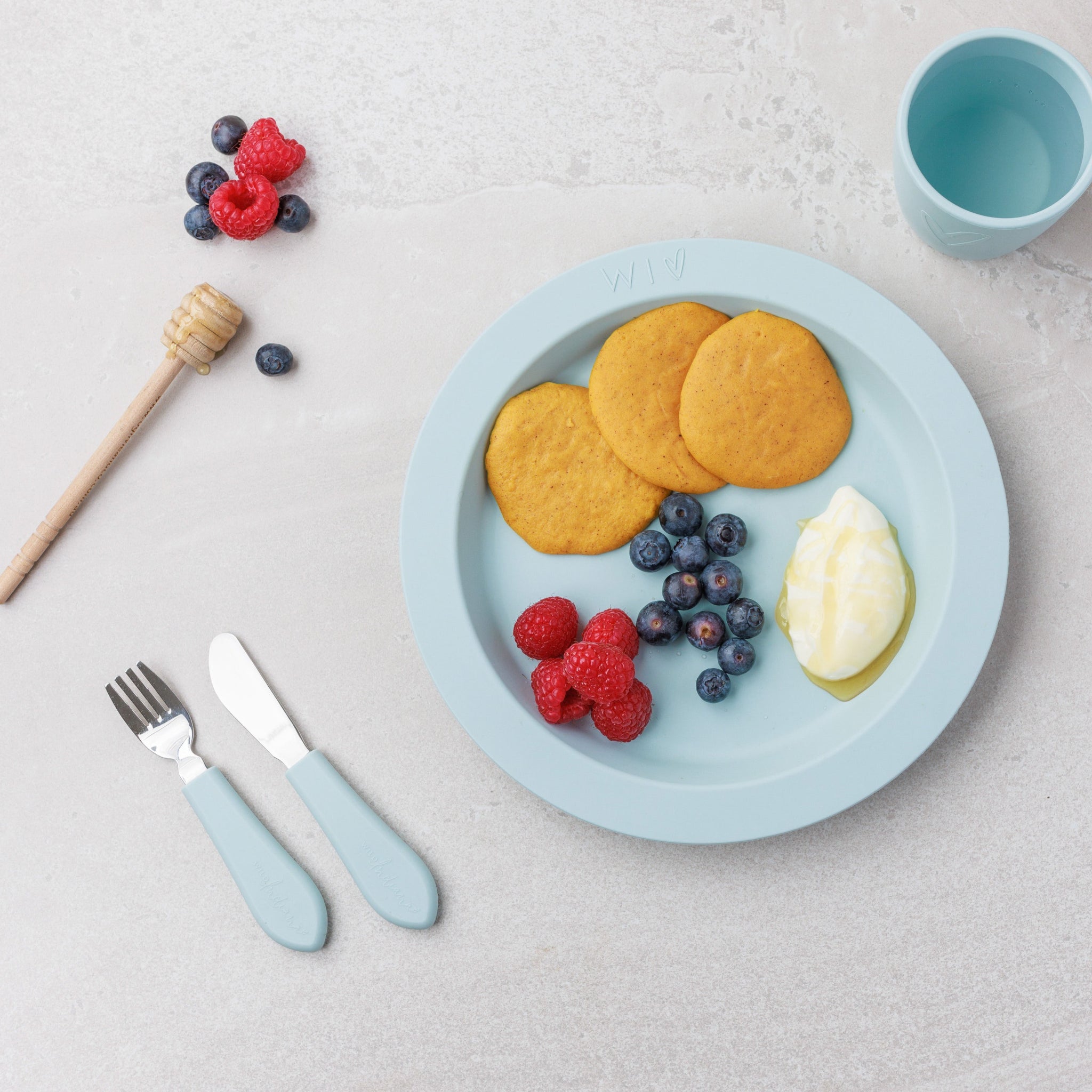 A plate of Pumpkin Pikelets served with honey and berries from Audrey and Alfie's Finger Food Range