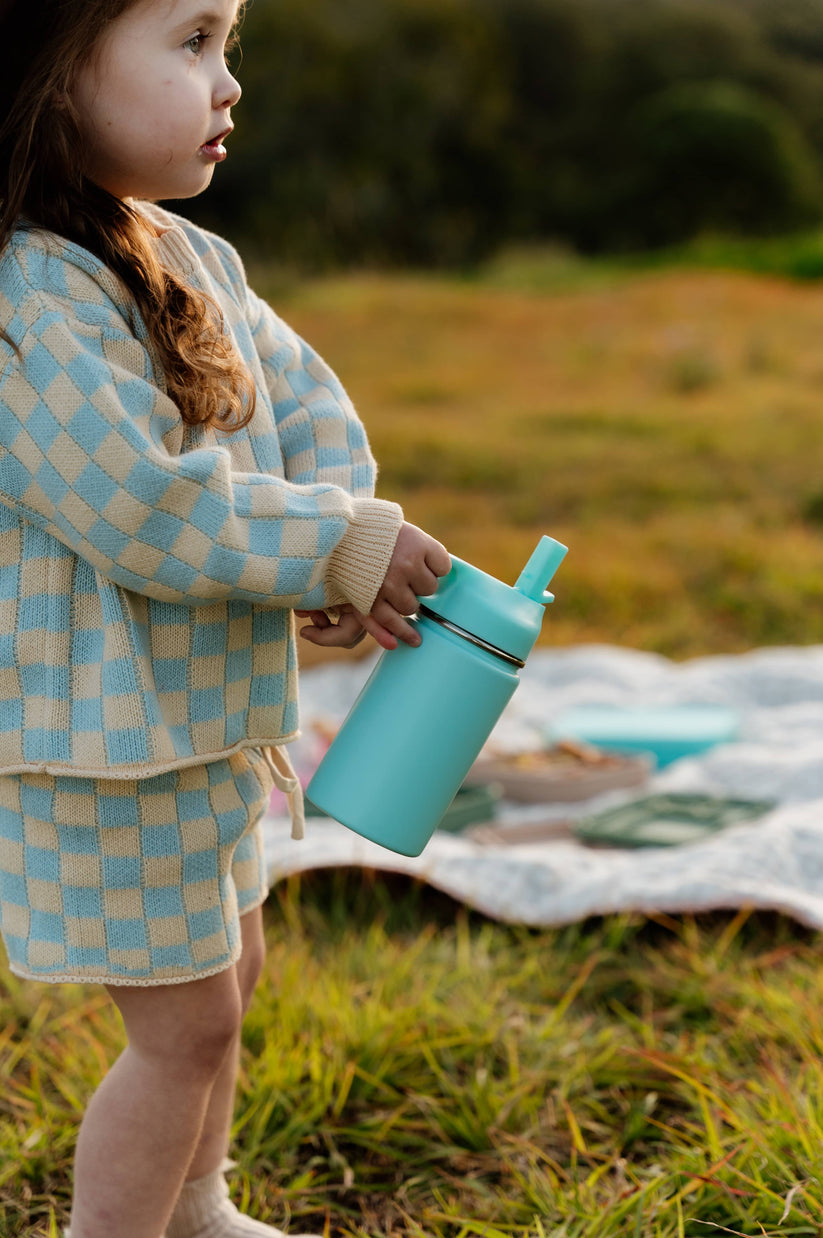 Toddler drinking from a water bottle from The Zero Waste People