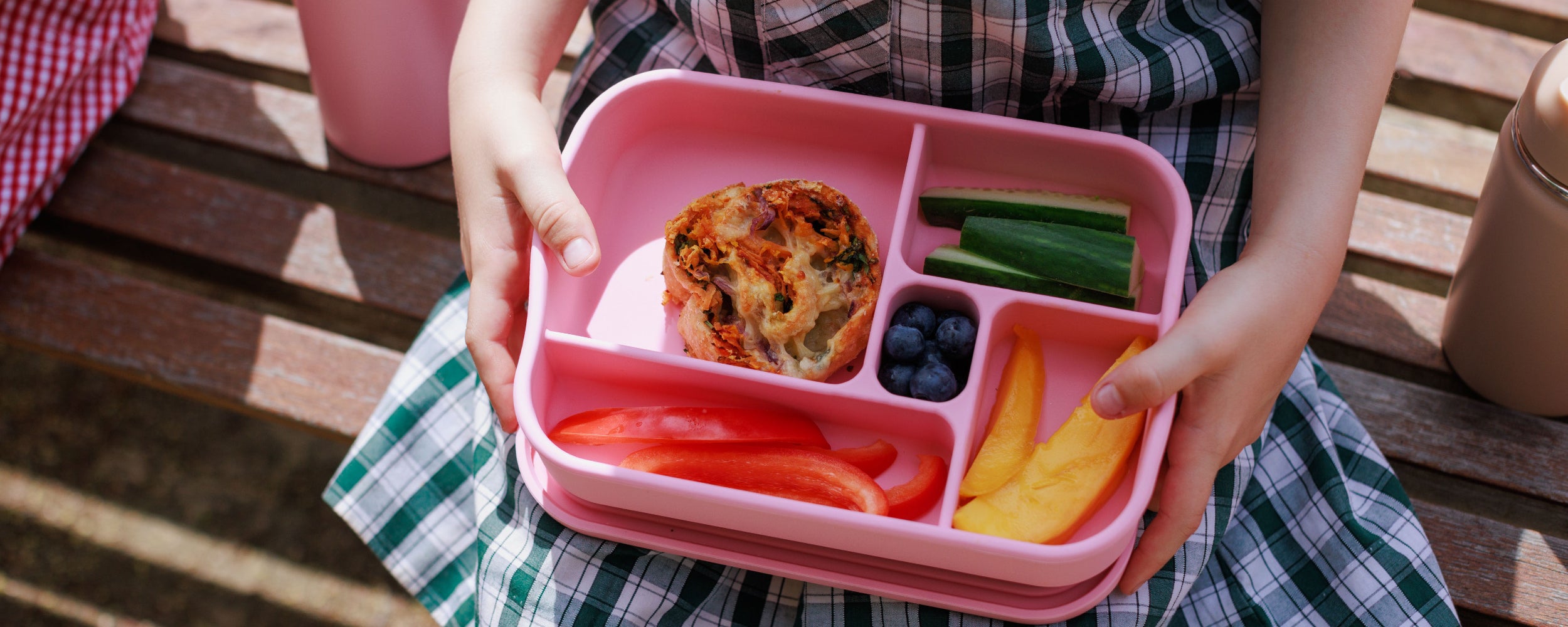 School kid holding lunchbox with Audrey and Alfie Veggie Pizza Scroll