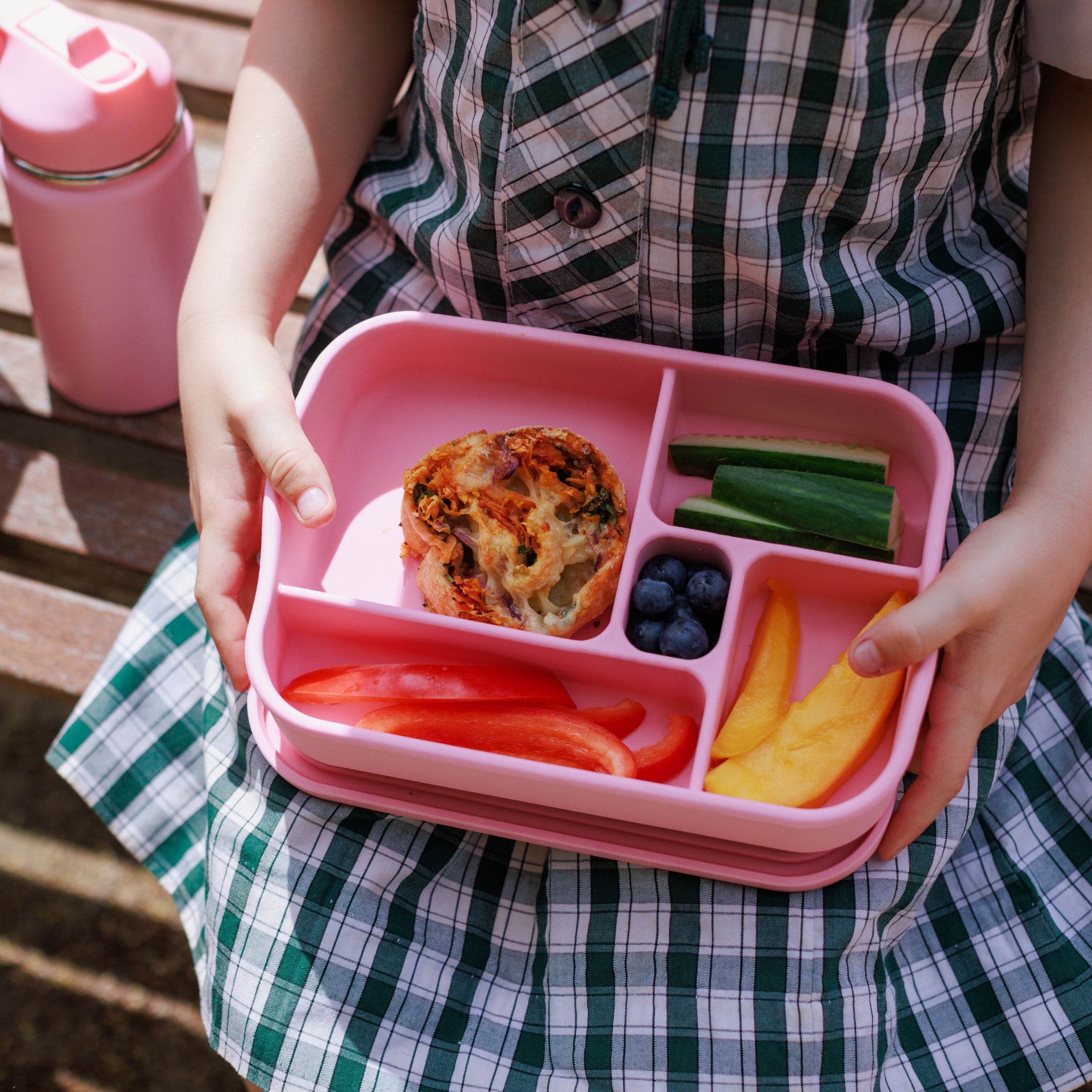 School kid holding lunchbox with Audrey and Alfie Veggie Pizza Scroll